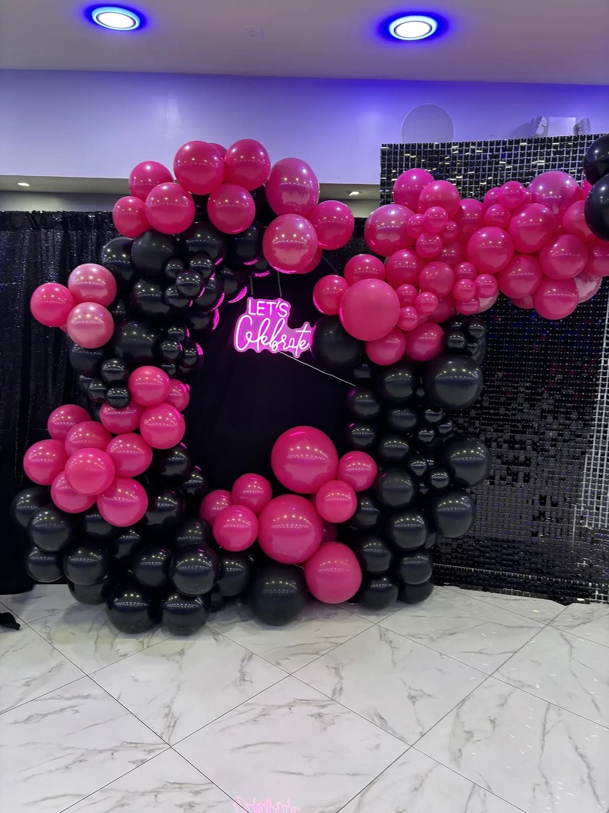 Pink and black celebration backdrop
